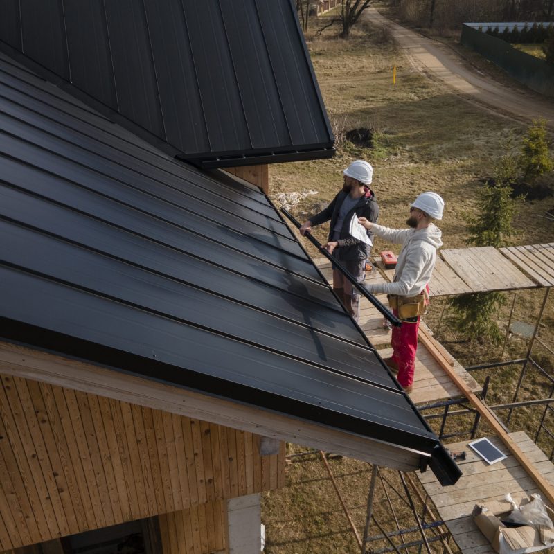 full-shot-roofers-working-with-helmets